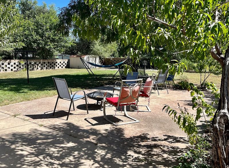 Patio w/ firepit and hammock. 