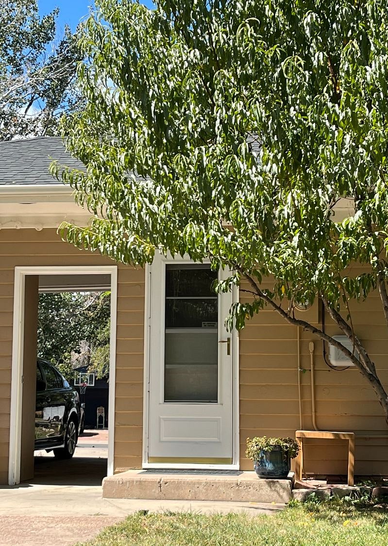 Entrance to carport and downstairs unit. 