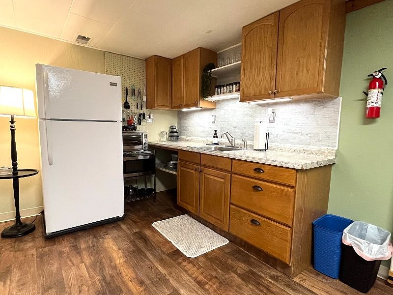 Stocked kitchen with full size fridge, stove top, convection oven, coffee pot, microwave, etc. 