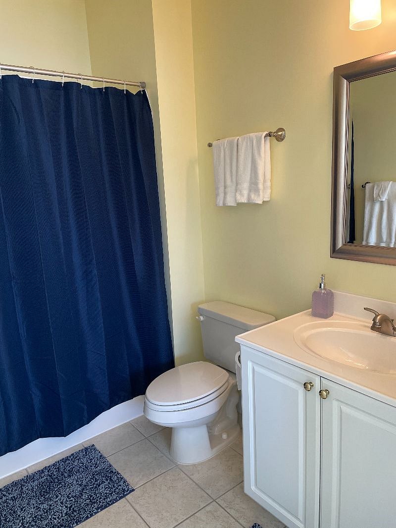 Master bedroom bath with tub/shower combo unit. Hairdryer under sink. Full length mirror behind door.  Starter supplies of shampoos, soap, conditioner for shower & toilet paper. Full dispenser bottle of hand soap. 