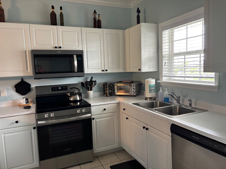 Fresh paint throughout kitchen.  New smooth top electric stove & microwave purchased in May 2023. 