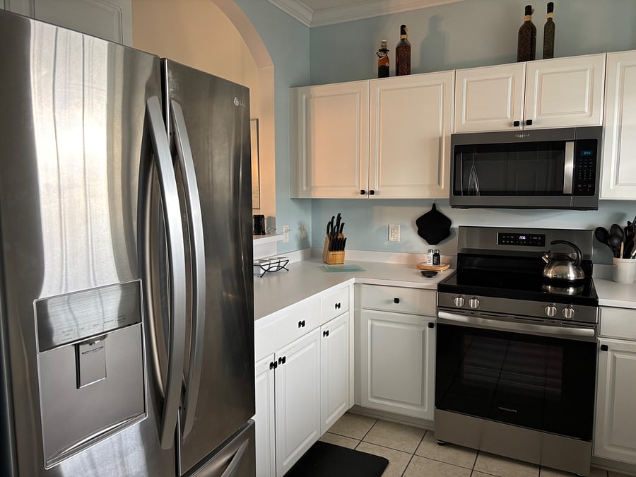 New stainless steel French door refrigerator purchased in May 2023.  Water dispenser in door exterior. Large freezer space with ice dispenser, bucket, & scoop. 