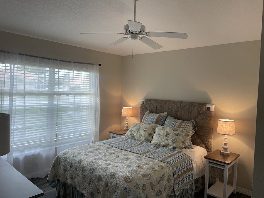 Queen size bed in guest bedroom