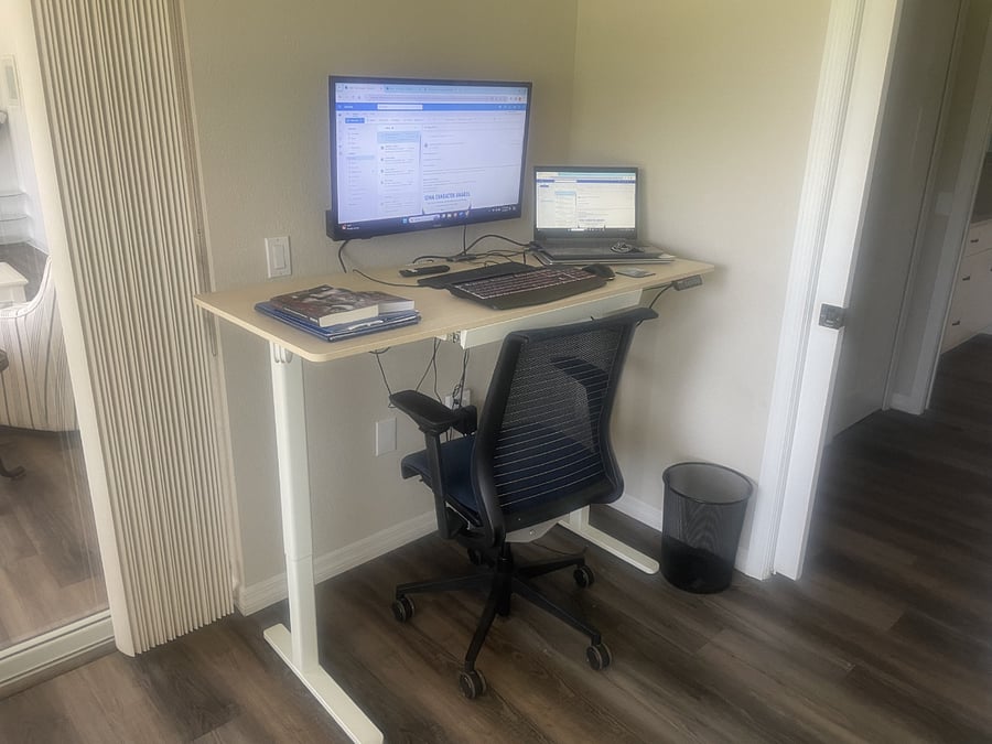 Third bedroom set up as an office complete with a new standing (or sitting) desk and wall mounted monitor.