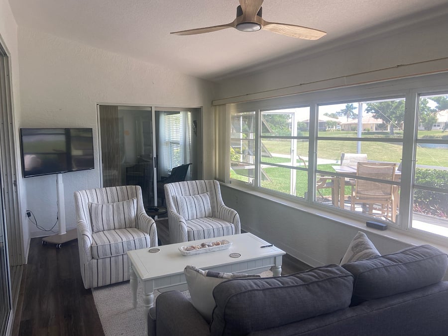 Inside Lanai with a second smart TV on a roller stand. Feel free to take it outside to watch an NFL Game!