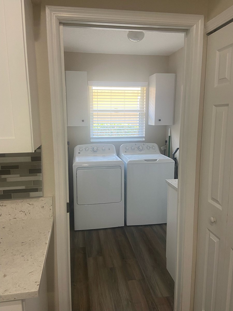 Laundry room off the kitchen and master bathroom. Leads into a large two-car garage.
