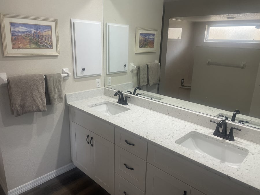 Master bath with double vanity. Huge walk-in shower on opposite wall.