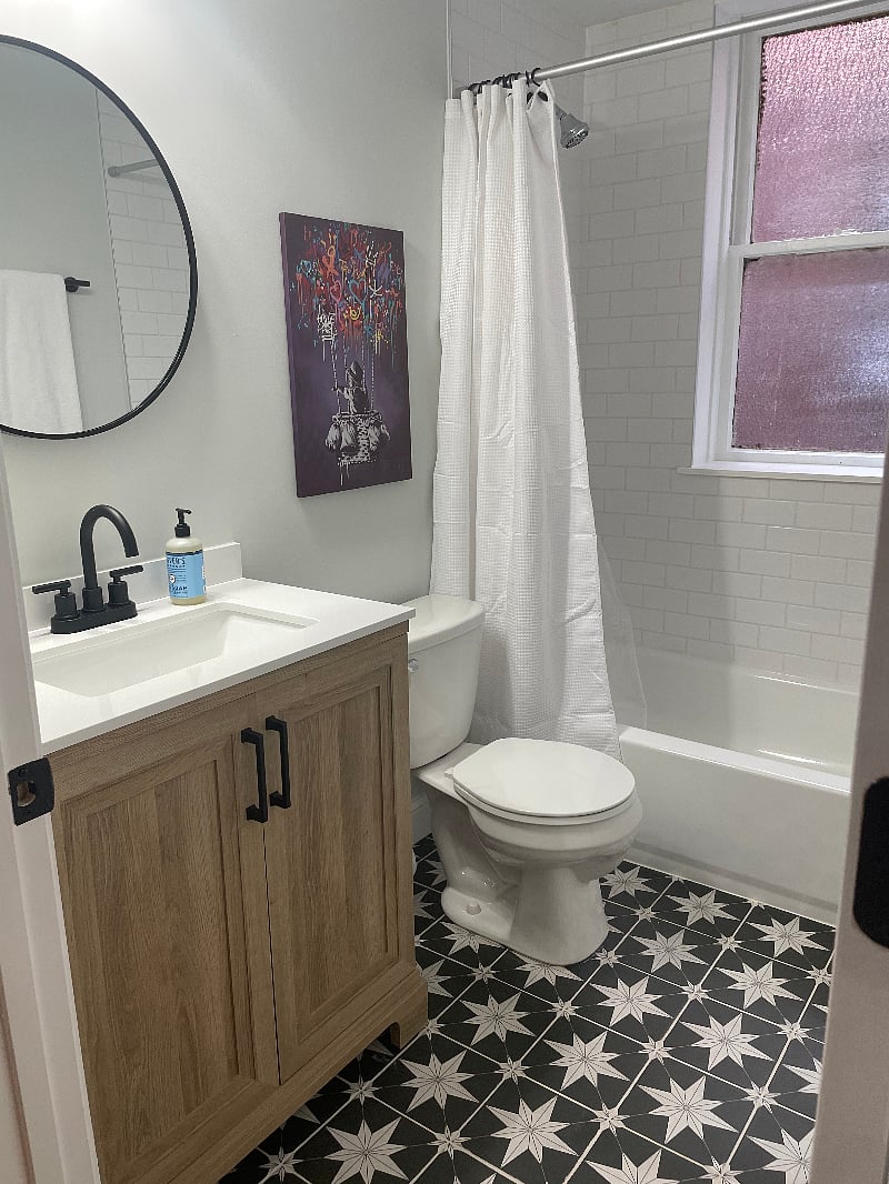 Fully renovated bathroom with fixtures and well lit