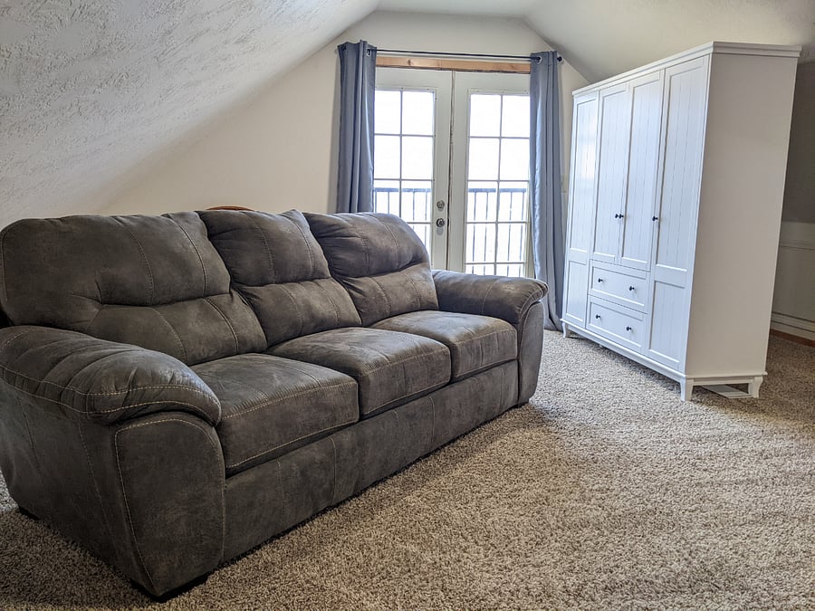 Huge loft bedroom above the 4 car garage. Beautiful queen bed frame with medium tempur-pedic mattress. This is a spaciously large room equipped with your very own tv, dressers, a closet dresser, mini refrigerator, microwave, blackout curtains, queen pullout sofa couch and a private full bathroom.