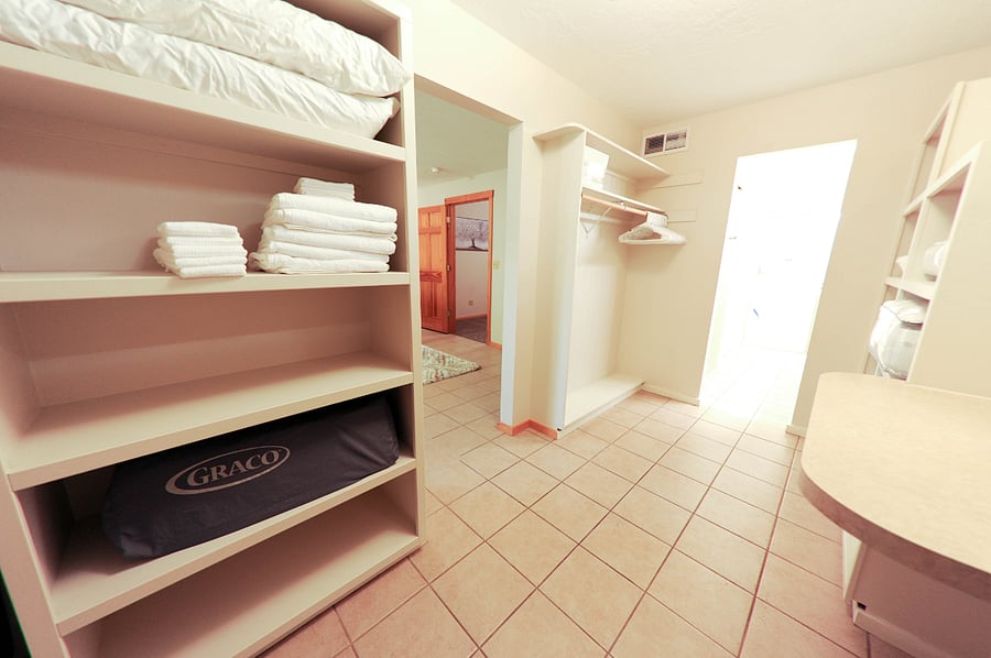 Walk-in closet with linens.