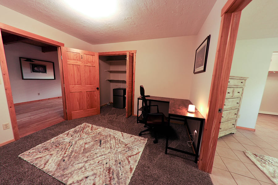 Private study desk room connected to the master bedroom. Extra closet space and a mini refrigerator.