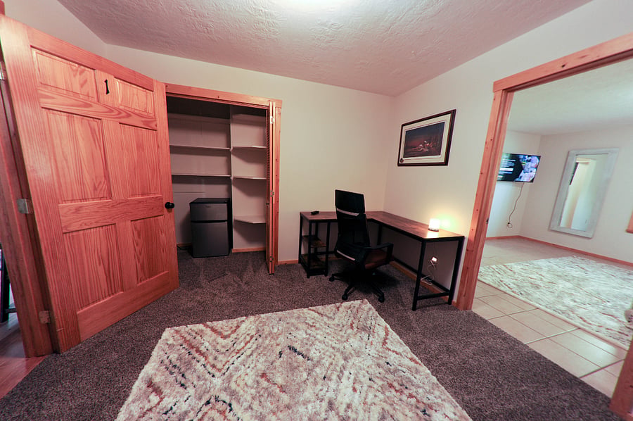 Private study desk room connected to the master bedroom. Extra closet space and a mini refrigerator.