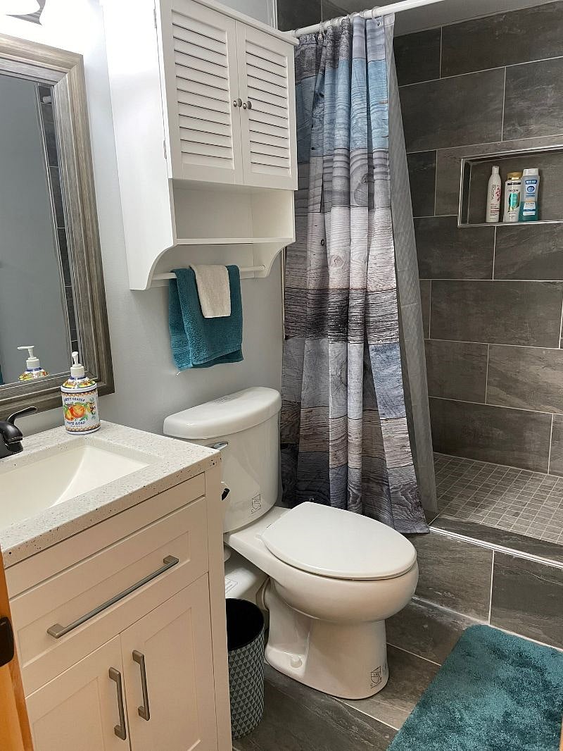 Bathroom with full shower.