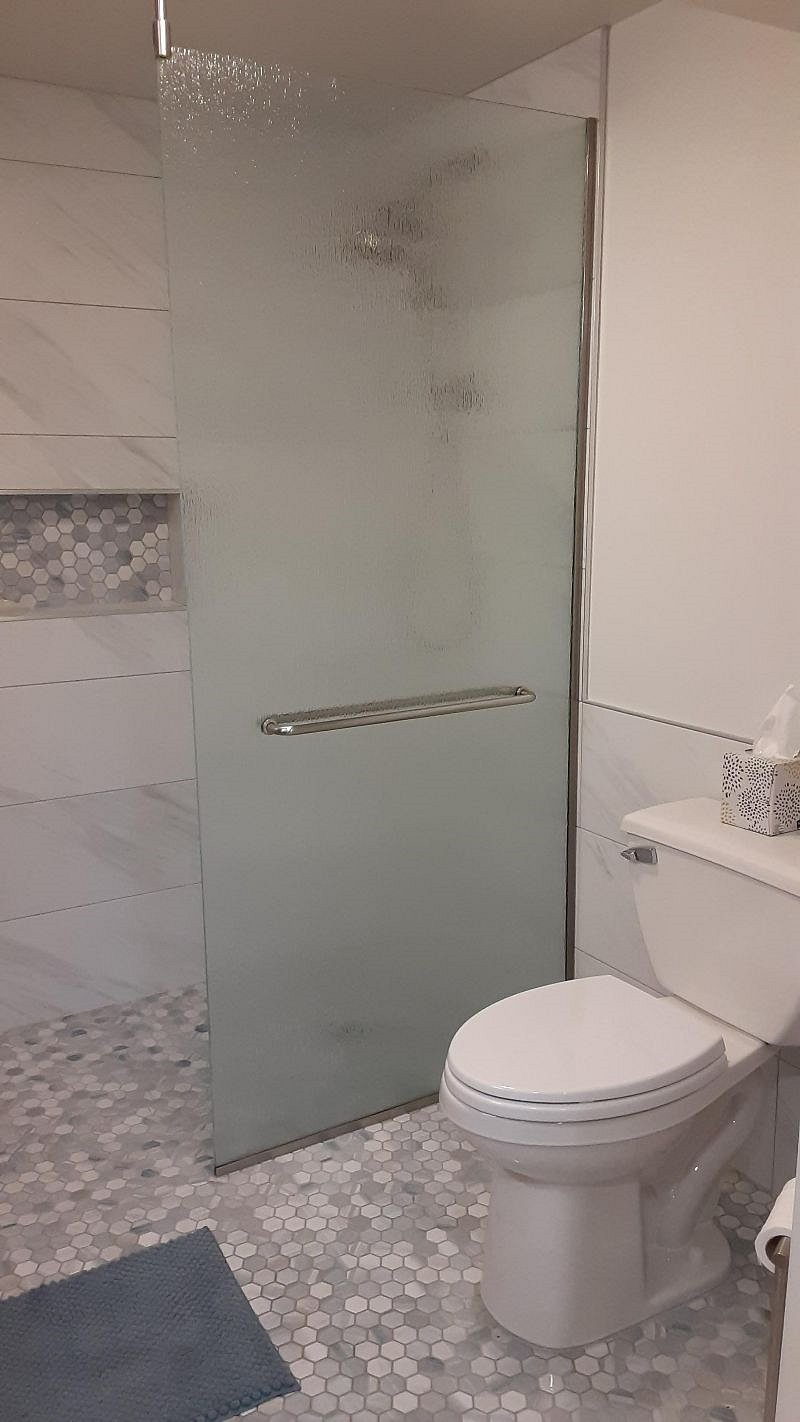 Walk in shower with heated tile floor.