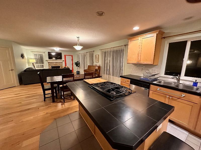 Open floor plan is great for guests. Don't forget the piano!