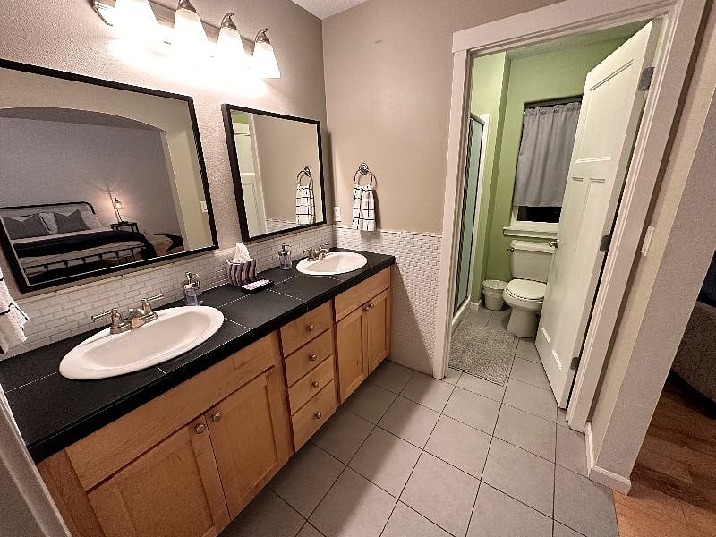 Master bathroom (connected to master bedroom) includes 2 sinks and separate water closet / stand up shower with seat.