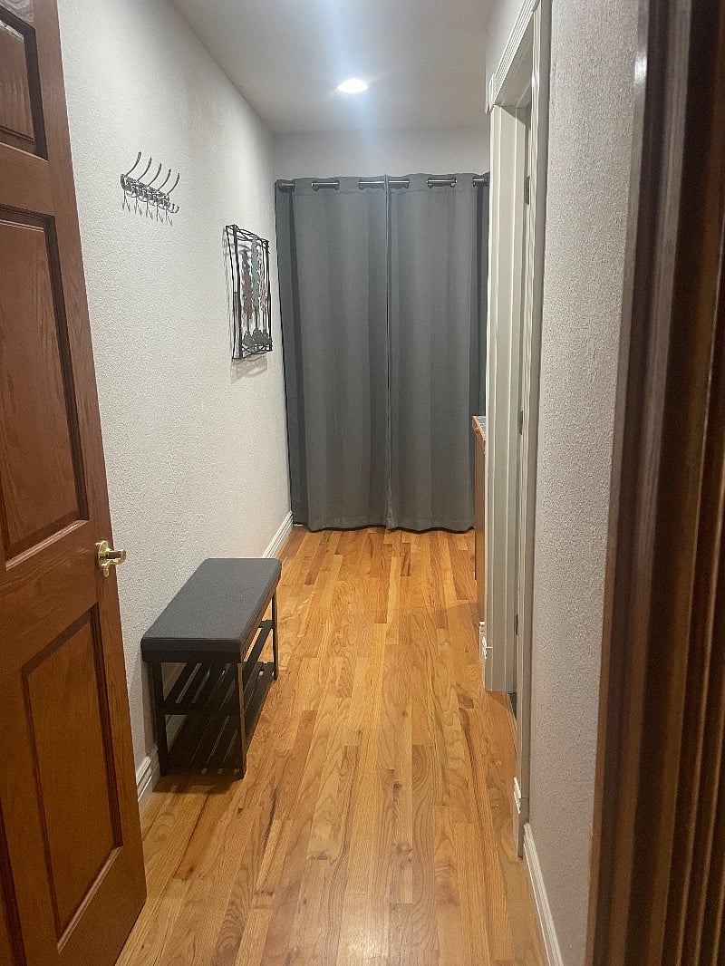 Entry way with coat rack not shown.