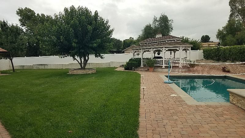 Backyard view of gazebo w- BBQ