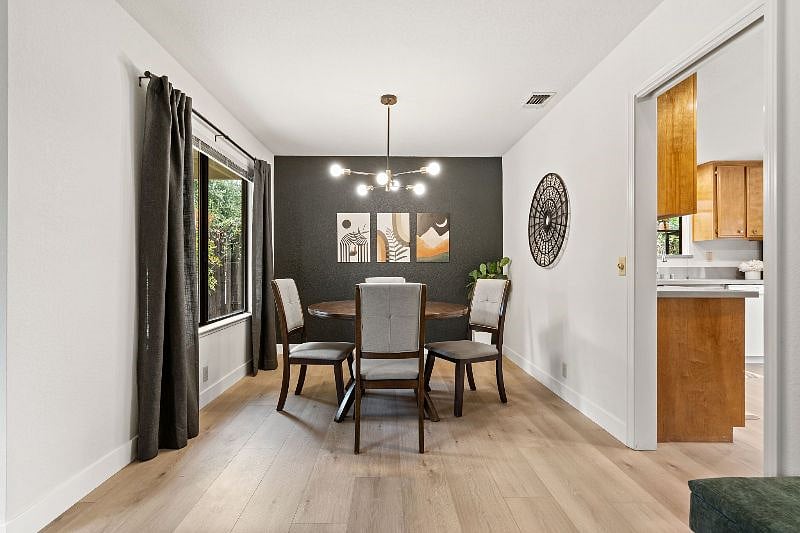 Dining room with backyard views.