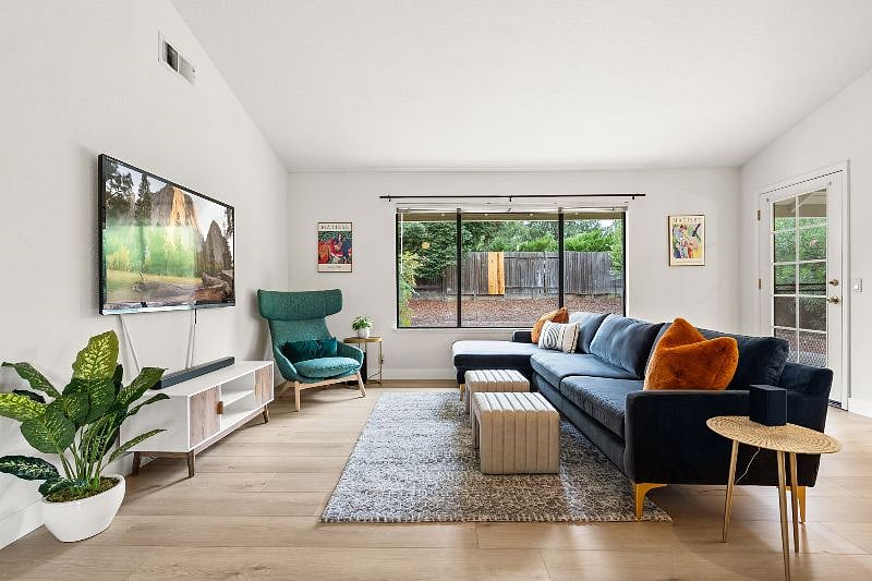Light and airy living space with 70" wifi-enabled TV