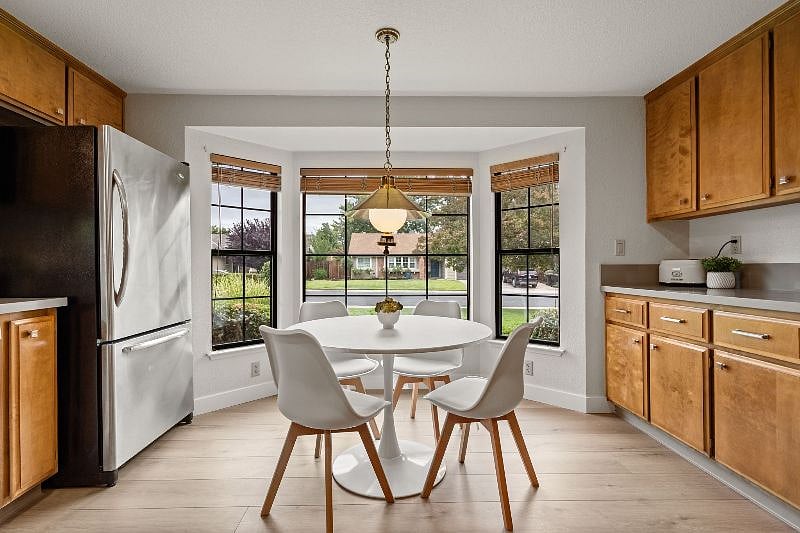 Breakfast nook with bay window and bar area.