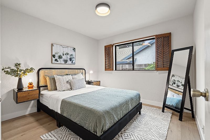 Secondary bedroom with near black out shutters and full length mirror.