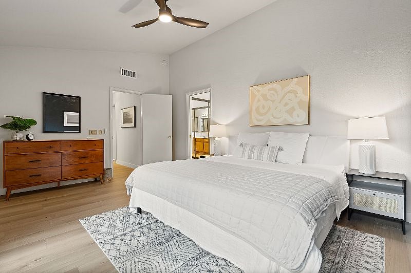 Primary suite with soaring ceilings and remote controlled light/fan.