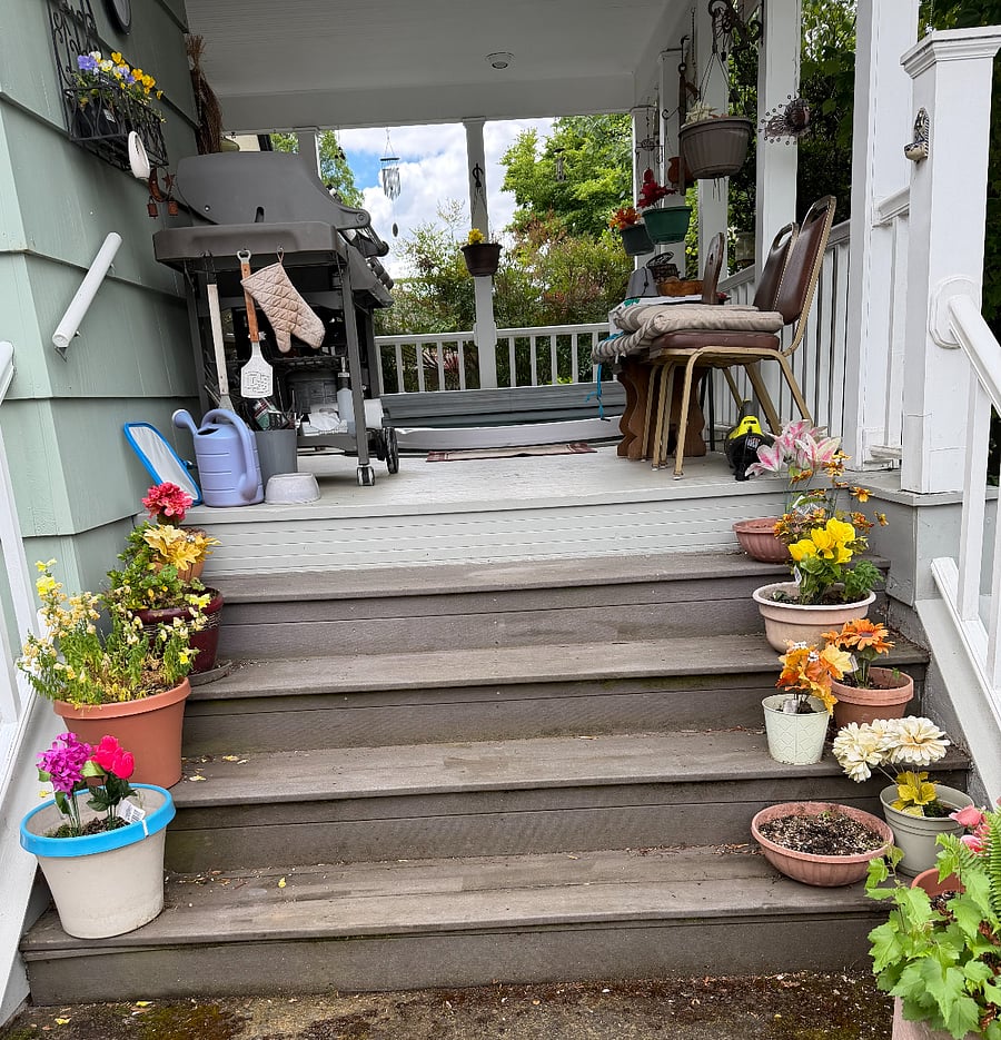 Back yard deck steps leading up to hot tub and seating ar