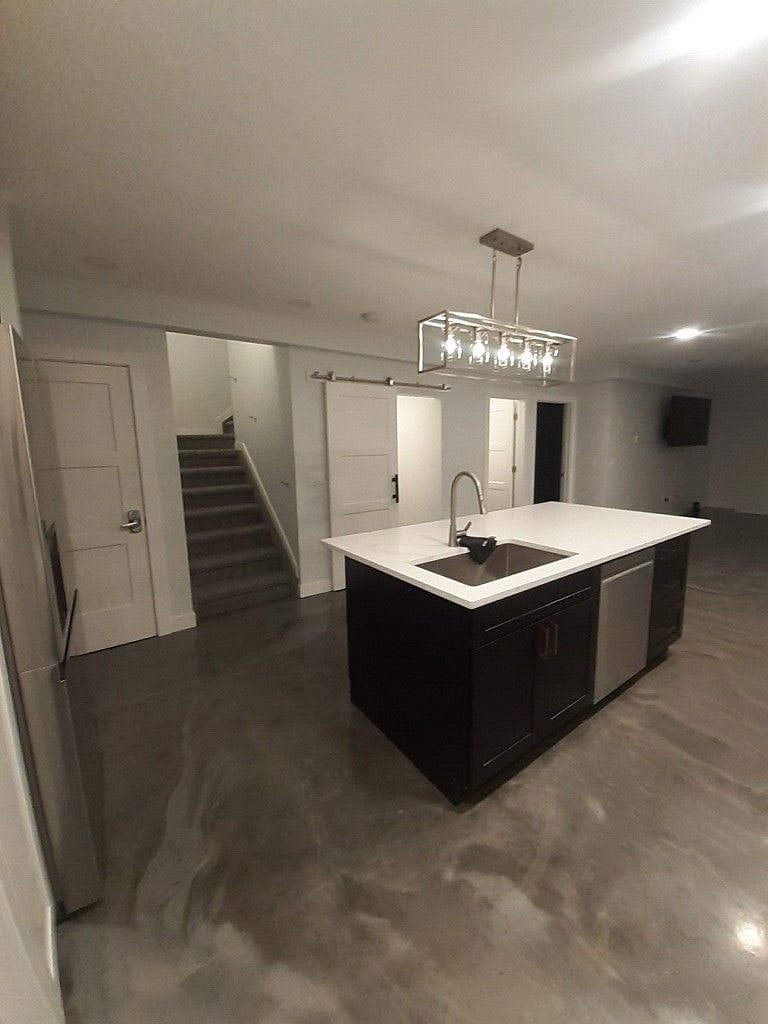 Kitchen island with sink and dishwasher
