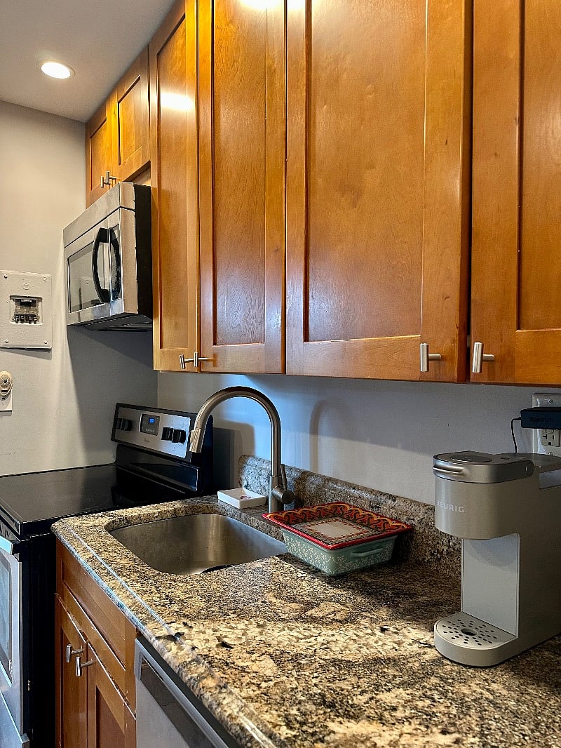Kitchen includes: granite countertops, stainless steel stove/microwave , refrigerator, and dishwasher.