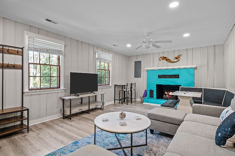 Living/dining room combo with TV and hall tree.