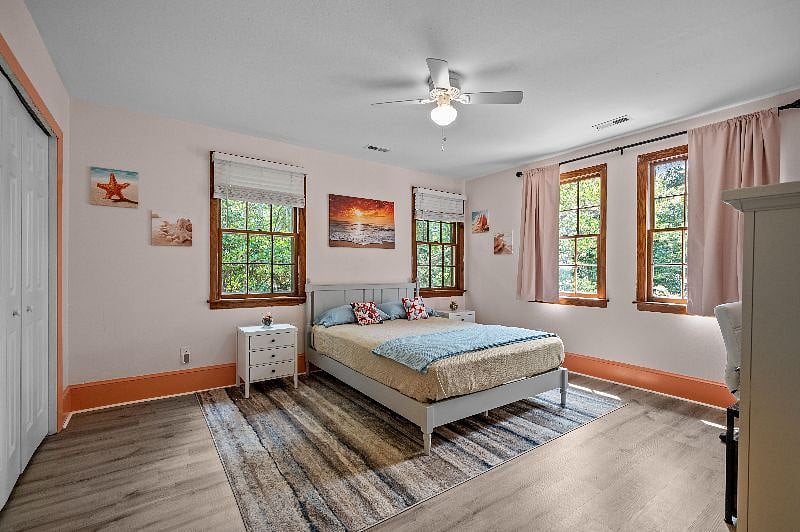 Master bedroom. Queen bed with two nightstands. Two closets on left side.