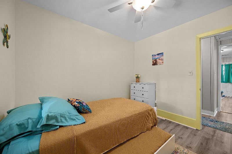 Second bedroom has a chest of drawers and a closet (not shown in this photo, but it is to the right side of the door).