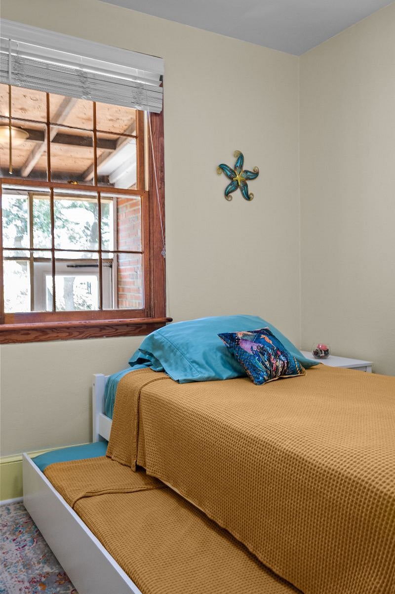 Nightstand to right side of bed.