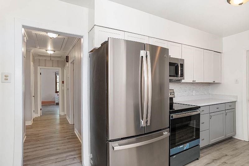 Kitchen facing hallway.