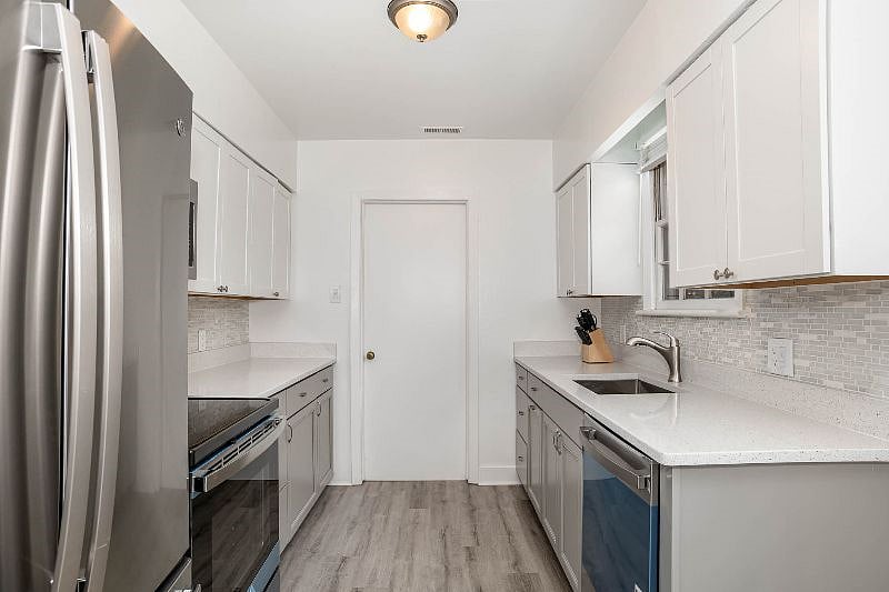 Kitchen facing laundry room.