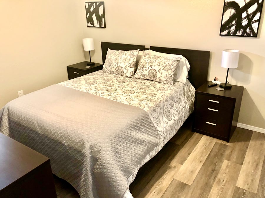 Bedroom #4 with queen bed, dresser, nightstands, smart tv and walk in closet