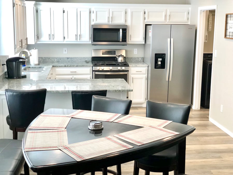 Kitchen and dining room with stainless steel appliances