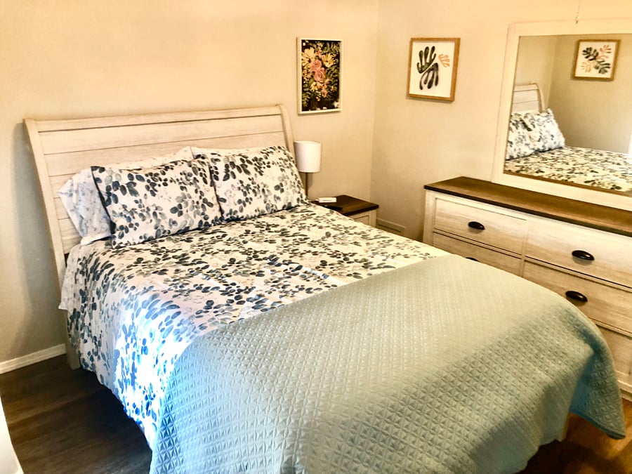 Bedroom #2 with queen bed, nightstand, dresser, chest, smart tv and dual closets