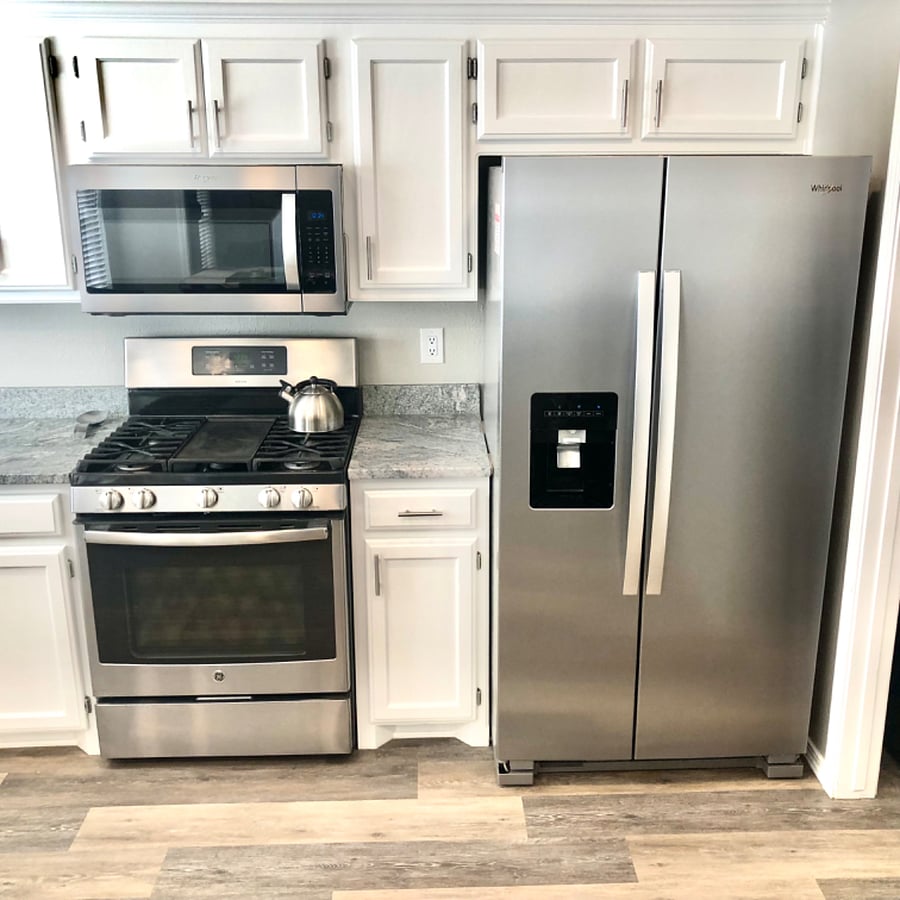 Gas stove/oven, microwave and refrigerator with indoor water and ice.