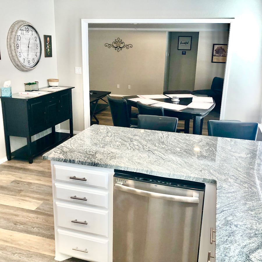Kitchen bar with dishwasher overlooking dining room