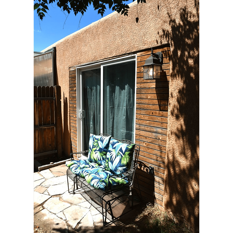 Patio space has 6-foot-high fencing for privacy. A large tree adds shade in Summer and the south facing patio allows for Winter use.
