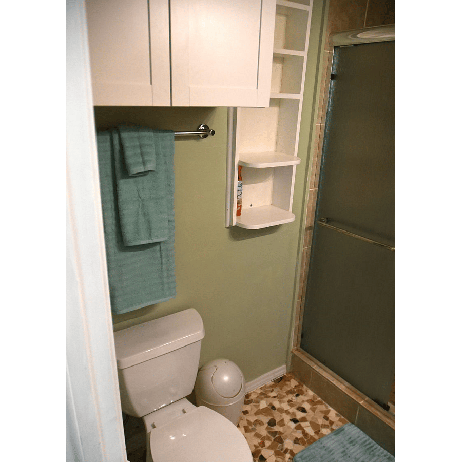 Bathroom has plenty of storage space