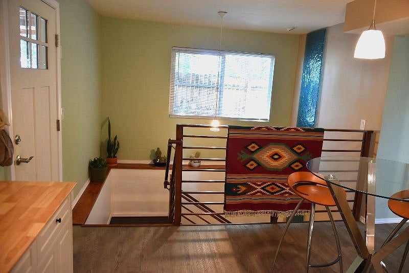 Access from carport showing stairs and lighting from bright south facing window.