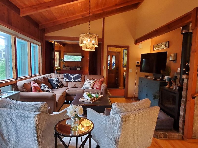 Living room with view into den on main floor