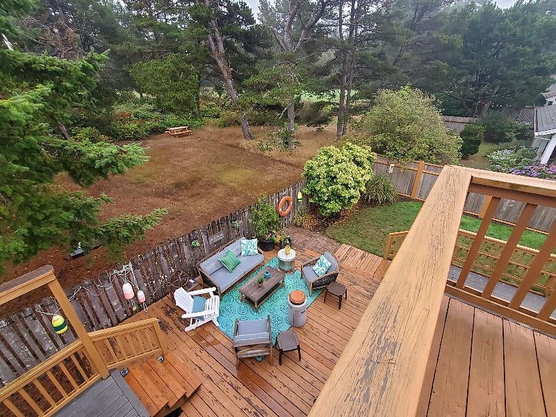 View down from the Primary bedroom balcony into backyard.
