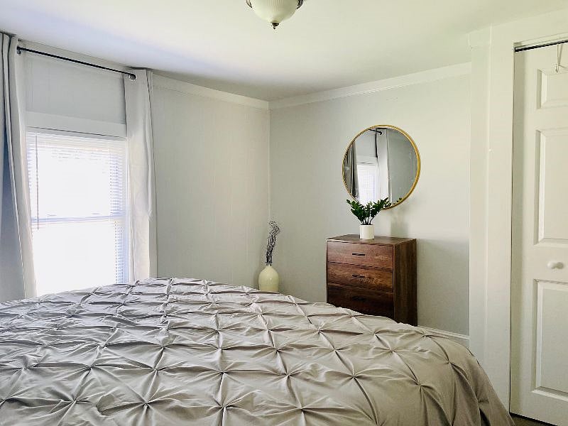 Bedroom #1: Includes king-sized bed, closet, dresser and blackout drapes.