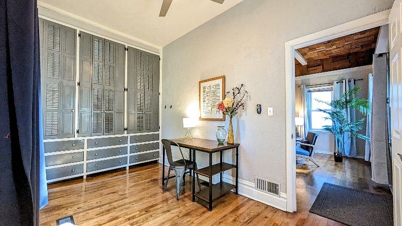 Main level Office with built in storage! Bright corner room with high ceilings