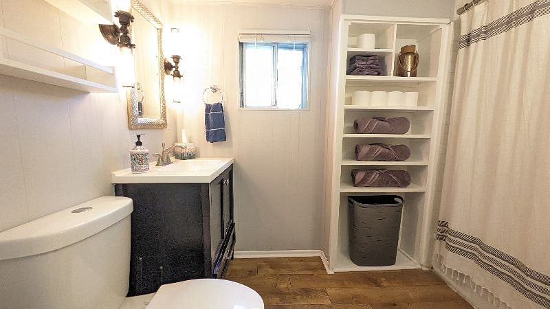 Bathroom on Main Level with tub shower combo and modern light fixtures
