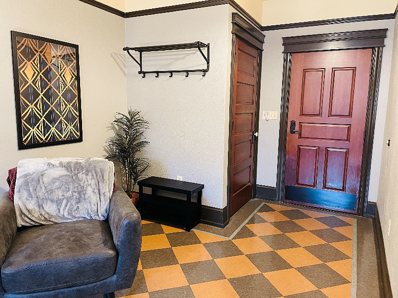 Entry way with coat hooks and storage bench